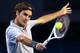 MELBOURNE, AUSTRALIA - JANUARY 19: Roger Federer of Switzerland plays a backhand in his third round match against Bernard Tomic of Australia during day six of the 2013 Australian Open at Melbourne Park on January 19, 2013 in Melbourne, Australia. (Photo by Cameron Spencer/Getty Images)