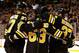 BOSTON, MA - JANUARY 21: Brad Marchand #63 of the Boston Bruins is congratulated by teammates after scoring a goal in the first period against the Winnipeg Jets during the season opener game on January 21, 2013 at TD Garden in Boston, Massachusetts. (Photo by Jared Wickerham/Getty Images)