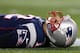 FOXBORO, MA - JANUARY 20: Tom Brady #12 of the New England Patriots lays on the ground after getting knocked down in the fourth quarter against the Baltimore Ravens during the 2013 AFC Championship game at Gillette Stadium on January 20, 2013 in Foxboro, Massachusetts. (Photo by Elsa/Getty Images)