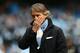 MANCHESTER, ENGLAND - DECEMBER 09: Manchester City Manager Roberto Mancini looks on prior to the Barclays Premier League match between Manchester City and Manchester United at the Etihad Stadium on December 9, 2012 in Manchester, England. (Photo by Clive Mason/Getty Images)