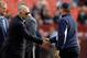 LANDOVER, MD - NOVEMBER 20: Dallas Cowboys owner Jerry Jones (L) shakes hands with head coach Jason Garrett (R) before the start of the Cowboys game against the Washington Redskins at FedExField on November 20, 2011 in Landover, Maryland. (Photo by Rob Carr/Getty Images)