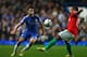 LONDON, ENGLAND - JANUARY 09: Cesar Azpilicueta of Chelsea plays the ball past Wayne Routledge of Swansea City during the Capital One Cup Semi-Final first leg match between Chelsea and Swansea City at Stamford Bridge on January 9, 2013 in London, England. (Photo by Clive Mason/Getty Images)