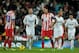 MADRID, SPAIN - DECEMBER 01: Radamel Falcao (3dR) of Club Atletico de Madrid reacts defeated with his teammate Arda Turan (L) while Sergio Ramos (2ndL) of Real Madrid and his teammates Pepe (2ndR) and Mezut Ozil (R) celebrate scoring their second goal during the La Liga match between Real Madrid CF and Club Atletico de Madrid at Estadio Santiago Bernabeu on December 1, 2012 in Madrid, Spain. (Photo by Gonzalo Arroyo Moreno/Getty Images)