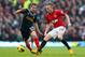MANCHESTER, ENGLAND - JANUARY 13: Tom Cleverley of Manchester United competes with Joe Allen of Liverpool during the Barclays Premier League match between Manchester United and Liverpool at Old Trafford on January 13, 2013 in Manchester, England. (Photo by Alex Livesey/Getty Images)
