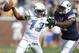 Oct 27, 2012; Atlanta, GA, USA; Brigham Young Cougars linebacker Ezekiel Ansah (right) prepares to sack Georgia Tech Yellow Jackets quarterback Tevin Washington (13) during the first quarter at Bobby Dodd Stadium. Mandatory Credit: Josh D. Weiss-USA TODAY Sports