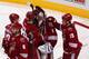 Coyotes mobbed goalie Jason LaBarbera after his first win since Dec 2011.