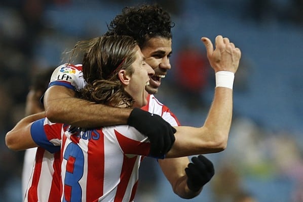Soccer-Atletico ease into King's Cup semi-final with Sevilla