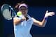 MELBOURNE, AUSTRALIA - JANUARY 24: Na Li of China plays a forehand in her Semifinal match against Maria Sharapova of Russia during day eleven of the 2013 Australian Open at Melbourne Park on January 24, 2013 in Melbourne, Australia. (Photo by Michael Dodge/Getty Images)