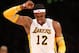 LOS ANGELES, CA - JANUARY 06: Dwight Howard #12 of the Los Angeles Lakers grimaces as he flexes his ailing shoulder in the game against the Denver Nuggets at Staples Center on January 6, 2013 in Los Angeles, California. The Nuggets won 112-105. NOTE TO USER: User expressly acknowledges and agrees that, by downloading and or using this photograph, User is consenting to the terms and conditions of the Getty Images License Agreement. (Photo by Stephen Dunn/Getty Images)