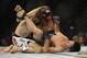 Jan 26, 2013; Chicago, IL, USA; Clay Guida (white shorts) fights against Hatsu Hioki (gray shorts) during UFC on FOX 6 at the United Center. Mandatory Credit: David Banks-USA TODAY Sports