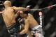Jan 26, 2013; Chicago, IL, USA; Demetrious Johnson (black shorts) fights John Dodson (white shorts) during UFC on FOX 6 for the world flyweight championship at the United Center. Mandatory Credit: David Banks-USA TODAY Sports