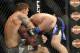 Jan 26, 2013; Chicago, IL, USA; Vladimir Matyushenko (black and blue shorts) fights against Ryan Bader (gray shorts) during UFC on FOX 6 at the United Center. Mandatory Credit: David Banks-USA TODAY Sports