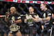 Jan 26, 2013; Chicago, IL, USA; Demetrious Johnson (left) celebrates after defeating John Dodson (not pictured) during UFC on FOX 6 for the world flyweight championship at the United Center. Mandatory Credit: David Banks-USA TODAY Sports