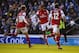 BRIGHTON, ENGLAND - JANUARY 26: Theo Walcott of Arsenal (C) celebrates with Aaron Ramsey (16) and Olivier Giroud (12) as her scores their third goal during the FA Cup with Budweiser Fourth Round match between Brighton & Hove Albion and Arsenal at Amex Stadium on January 26, 2013 in Brighton, England. (Photo by Mike Hewitt/Getty Images)