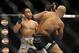 Jan 26, 2013; Chicago, IL, USA; Demetrious Johnson (black shorts) fights John Dodson (white shorts) during UFC on FOX 6 for the world flyweight championship at the United Center. Mandatory Credit: David Banks-USA TODAY Sports