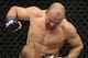 Jan 26, 2013; Chicago, IL, USA; Rampage Jackson (black shorts) fights against Glover Teixeira (black and white shorts) during UFC on FOX 6 at the United Center. Mandatory Credit: David Banks-USA TODAY Sports