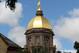 SOUTH BEND, IN - SEPTEMBER 04: The 'Golden Dome' is seen on the campus of Notre Dame University before a game between the Notre Dame Fighting Irish and the Purdue Boilermakers at Notre Dame Stadium on September 4, 2010 in South Bend, Indiana. (Photo by Jonathan Daniel/Getty Images)