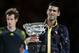 MELBOURNE, AUSTRALIA - JANUARY 27: Andy Murray of Great Britain (L) watches Novak Djokovic of Serbia hold the Norman Brookes Challenge Cup after Djokovic won their men's final match during day fourteen of the 2013 Australian Open at Melbourne Park on January 27, 2013 in Melbourne, Australia. (Photo by Scott Barbour/Getty Images)