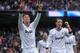 MADRID, SPAIN - JANUARY 27: Cristiano Ronaldo (L) of Real Madrid CF celebrates with Mesut Ozil after scoreding Real's 2nd goal during the La Liga match between Real Madrid CF and Getafe CF at estadio Santiago Bernabeu on January 27, 2013 in Madrid, Spain. (Photo by Denis Doyle/Getty Images)
