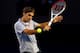 MELBOURNE, AUSTRALIA - JANUARY 25: Roger Federer of Switzerland plays a backhand in his semifinal match against Andy Murray of Great Britain during day twelve of the 2013 Australian Open at Melbourne Park on January 25, 2013 in Melbourne, Australia. (Photo by Julian Finney/Getty Images)