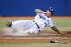 TORONTO, CANADA - OCTOBER 1: Brett Lawrie #13 of the Toronto Blue Jays slides across home plate in the seventh inning to score a run during MLB game action against the Minnesota Twins on October 1, 2012 at Rogers Centre in Toronto, Ontario, Canada. (Photo by Tom Szczerbowski/Getty Images)