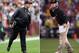 (FILE PHOTO) In this composite image a comparison has been made between Head coach John Harbaugh of the Baltimore Ravens (L) and his brother Head coach Jim Harbaugh of the San Francisco 49ers. Jim and John Harbaugh will become the first brothers to face each other as coaches in the Super Bowl. ***LEFT IMAGE*** LANDOVER, MD - DECEMBER 09: Head coach John Harbaugh of the Baltimore Ravens looks on from the sidelines during the first half of the Ravens 31-28 overtime loss to the Washington Redskins at FedExField on December 9, 2012 in Landover, Maryland. (Photo by Rob Carr/Getty Images) ***RIGHT IMAGE*** SAN FRANCISCO, CA - JANUARY 22: Head coach Jim Harbaugh of the San Francisco 49ers gestures during the NFC Championship Game against the New York Giants at Candlestick Park on January 22, 2012 in San Francisco, California. (Photo by Ezra Shaw/Getty Images)