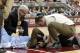 Jan 29, 2013; Chestnut Hill, Massachusetts, USA; A trainer and North Carolina Tar Heels head coach Roy Williams (left) holds the hand of guard P.J. Hairston (15) after he was injured during the first half against the Boston College Eagles at Conte Forum. Mandatory Credit: Greg M. Cooper-USA TODAY Sports
