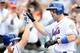 NEW YORK, NY - SEPTEMBER 27: David Wright #5 of the New York Mets is greeted by teammates after hitting a home run against the Pittsburgh Pirates at Citi Field on September 27, 2012 in the Flushing neighborhood of the Queens borough of New York City. (Photo by Alex Trautwig/Getty Images)