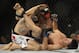 Jan 26, 2013; Chicago, IL, USA; Clay Guida (white shorts) fights against Hatsu Hioki (gray shorts) during UFC on FOX 6 at the United Center. Mandatory Credit: David Banks-USA TODAY Sports