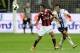MILAN, ITALY - SEPTEMBER 15: Urby Emanuelson (L) of AC Milan and Cristian Raimondi of Atalanta BC compete for the ball during the Serie A match between AC Milan and Atalanta BC at San Siro Stadium on September 15, 2012 in Milan, Italy. (Photo by Claudio Villa/Getty Images)