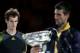 MELBOURNE, AUSTRALIA - JANUARY 27: Andy Murray of Great Britain (L) watches Novak Djokovic of Serbia hold the Norman Brookes Challenge Cup after Djokovic won their men's final match during day fourteen of the 2013 Australian Open at Melbourne Park on January 27, 2013 in Melbourne, Australia. (Photo by Scott Barbour/Getty Images)