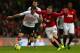 MANCHESTER, ENGLAND - JANUARY 26: Giorgos Karagounis of Fulham battles for the ball with Wayne Rooney of Manchester United during the FA Cup with Budweiser Fourth Round match between Manchester United and Fulham at Old Trafford on January 26, 2013 in Manchester, England. (Photo by Clive Mason/Getty Images)