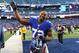 EAST RUTHERFORD, NJ - DECEMBER 30: Osi Umenyiora #72 of the New York Giants waves to the crowd after a 42-7 win against the Philadelphia Eagles at MetLife Stadium on December 30, 2012 in East Rutherford, New Jersey. (Photo by Al Bello/Getty Images)