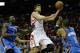 HOUSTON, TX - DECEMBER 29: Chandler Parsons #25 of the Houston Rockets shoots against Kendrick Perkins #5 and Russell Westbrook #0 of the Oklahoma Thunder at the Toyota Center on December 29, 2012 in Houston, Texas. NOTE TO USER: User expressly acknowledges and agrees that, by downloading and or using this photograph, User is consenting to the terms and conditions of the Getty Images License Agreement. (Photo by Scott Halleran/Getty Images)