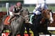 Apr 3, 2011; Hallandale, FL, USA; Julien Leparoux (7) aboard Dialed In and jockey Jesus Castanon (5) aboard Shackleford dual down the stretch in the Florida Derby at Gulfstream Park race course. Mandatory Credit: Mark Zerof-USA TODAY Sports