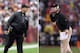 (FILE PHOTO) In this composite image a comparison has been made between Head coach John Harbaugh of the Baltimore Ravens (L) and his brother Head coach Jim Harbaugh of the San Francisco 49ers. Jim and John Harbaugh will become the first brothers to face each other as coaches in the Super Bowl. ***LEFT IMAGE*** LANDOVER, MD - DECEMBER 09: Head coach John Harbaugh of the Baltimore Ravens looks on from the sidelines during the first half of the Ravens 31-28 overtime loss to the Washington Redskins at FedExField on December 9, 2012 in Landover, Maryland. (Photo by Rob Carr/Getty Images) ***RIGHT IMAGE*** SAN FRANCISCO, CA - JANUARY 22: Head coach Jim Harbaugh of the San Francisco 49ers gestures during the NFC Championship Game against the New York Giants at Candlestick Park on January 22, 2012 in San Francisco, California. (Photo by Ezra Shaw/Getty Images)