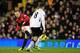 LONDON, ENGLAND - FEBRUARY 02: Wayne Rooney of Manchester United scores the opening goal during the Barclays Premier League match between Fulham and Manchester United at Craven Cottage on February 2, 2013 in London, England. (Photo by Jamie McDonald/Getty Images)
