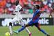 PORT ELIZABETH, SOUTH AFRICA - FEBRUARY 02: Soares Luis of Cape Verde tries to tackle Mohammed Rabiu Alhassan of Gana in action during the 2013 Africa Cup of Nations Quarter-Final match between Ghana and Cape Verde at the Nelson Mandela Bay Stadium on February 2, 2013 in Port Elizabeth, South Africa. (Photo by Ian Walton/Getty Images)