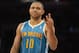 Jan 29, 2013; Los Angeles, CA, USA; New Orleans Hornets shooting guard Eric Gordon (10) signals against the Los Angeles Lakers during the game at Staples Center. Mandatory Credit: Richard Mackson-USA TODAY Sports