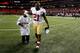 ATLANTA, GA - JANUARY 20: Frank Gore #21 and his son walk off the field after the San Francisco 49ers defeat the Atlanta Falcons 28-24 in the NFC Championship game at the Georgia Dome on January 20, 2013 in Atlanta, Georgia. (Photo by Chris Graythen/Getty Images)