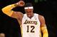 LOS ANGELES, CA - JANUARY 06: Dwight Howard #12 of the Los Angeles Lakers grimaces as he flexes his ailing shoulder in the game against the Denver Nuggets at Staples Center on January 6, 2013 in Los Angeles, California. The Nuggets won 112-105. NOTE TO USER: User expressly acknowledges and agrees that, by downloading and or using this photograph, User is consenting to the terms and conditions of the Getty Images License Agreement. (Photo by Stephen Dunn/Getty Images)