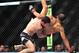 Feb 2, 2013; Las Vegas, NV, USA; Frankie Edgar (left) picks up Jose Aldo (right) and takes him down during UFC 156 at the Mandalay Bay Events Center. Mandatory Credit: Gary A. Vasquez-USA TODAY Sports