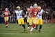 SAN FRANCISCO, CA - JANUARY 12: Quarterback Colin Kaepernick #7 of the San Francisco 49ers runs for a touchdown in the first quarter against the Green Bay Packers during the NFC Divisional Playoff Game at Candlestick Park on January 12, 2013 in San Francisco, California. (Photo by Harry How/Getty Images)