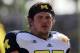 Taylor Lewan turned down a near-certain first-round draft pick to be the centerpiece of Michigan's offensive line in 2013.