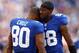 EAST RUTHERFORD, NJ - OCTOBER 21: Victor Cruz #80 is congratulated by teammate Hakeem Nicks #88 of the New York Giants after Cruz scored the game winning touchdown in the fourth quarter against the Washington Redskins on October 21, 2012 at MetLife Stadium in East Rutherford, New Jersey.The New York Giants defeated the Washington Redskins 27-23. (Photo by Elsa/Getty Images)