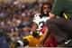 INDIANAOPLIS, IN - OCTOBER 7: Cedric Benson #32 of the Green Bay Packers is carted off of the field after suffering an injury against the Indianapolis Colts at Lucas Oil Stadium on October 7, 2012 in Indianapolis, Indiana. The Colts defeated the Packers 30-27. (Photo by Jonathan Daniel/Getty Images)