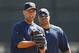 TAMPA, FL - FEBRUARY 21: Derek Jeter #2 and Robinson Cano #24 of the New York Yankees talk during the second day of full teams workouts at Spring Training on February 21, 2011 at the George M. Steinbrenner Field in Tampa, Florida. (Photo by Leon Halip/Getty Images)