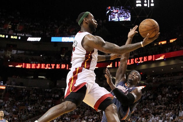 James Nearly Perfect as Heat Hold off Bobcats 99-94
