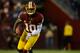 LANDOVER, MD - JANUARY 06: Robert Griffin III #10 of the Washington Redskins runs the ball against the Seattle Seahawks during the NFC Wild Card Playoff Game at FedExField on January 6, 2013 in Landover, Maryland. (Photo by Patrick McDermott/Getty Images)