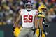GREEN BAY, WI - JANUARY 15: Michael Boley #59 of the New York Giants reacts after a sack in the fourth quarter against the Green Bay Packers during their NFC Divisional playoff game at Lambeau Field on January 15, 2012 in Green Bay, Wisconsin. (Photo by Jamie Squire/Getty Images)